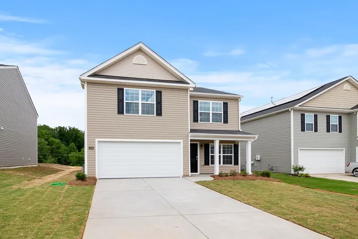 A two-storey house with a new driveway